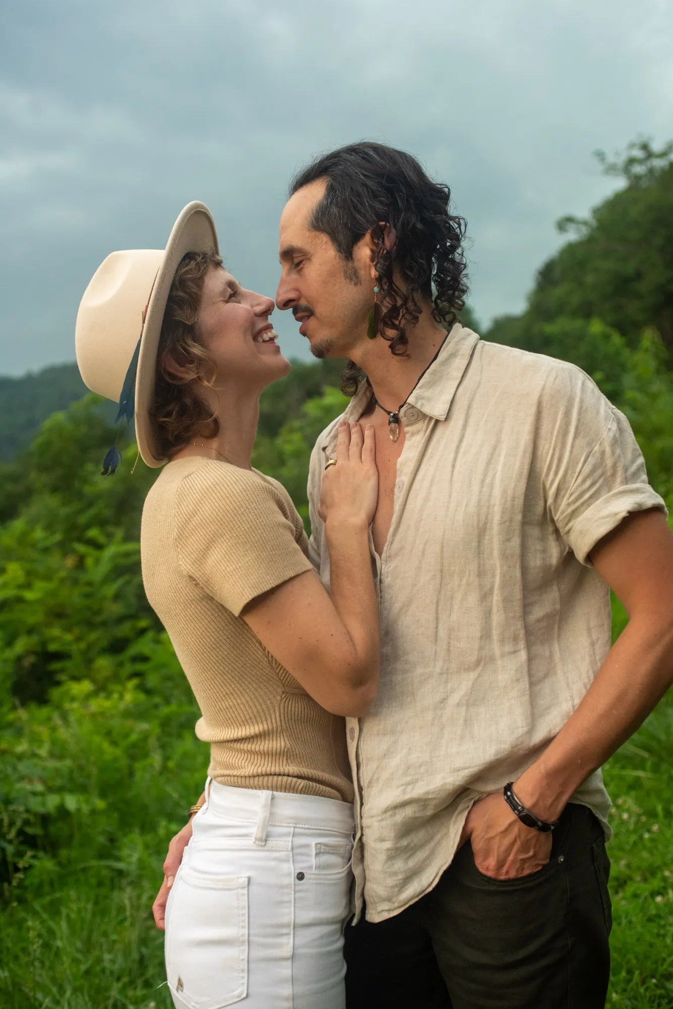 A couple laughing nose to nose at a Blue Ridge mountain overlook